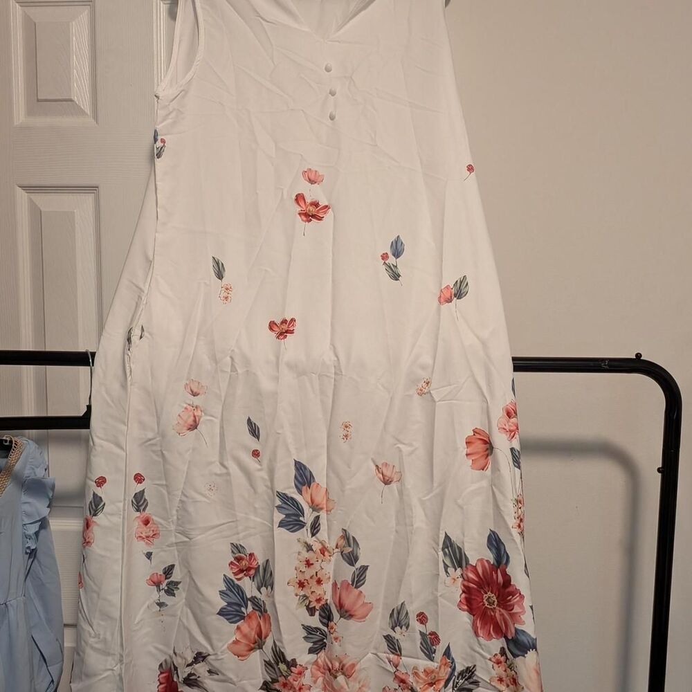 White floral maxi dress with pink, red, and blue flowers